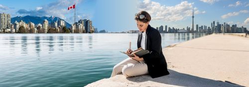 Woman using a LAMY Lx Fountain pen with Canada in the background
