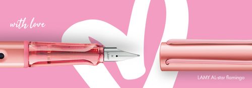 LAMY AL-star flamingo pen set against a pink background with a white heart shape.