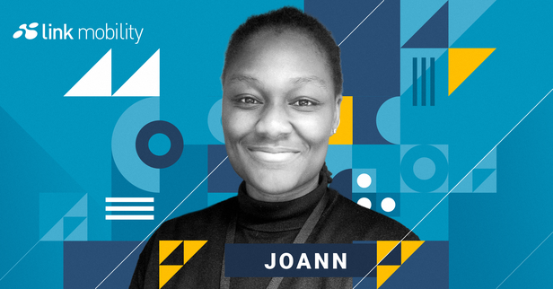 Smiling person on a geometric blue and yellow design background with "Link Mobility" and "Joann" text.