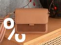 Image of a WhatsApp Business messaging carousel mockup showing a brown leather handbags promotion with rich media and discount offer, illustrating marketing campaigns using WhatsApp Business API to drive customer engagement and conversions