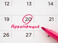 Image of a mobile notification showing an appointment deposit request with a secure payment link, prompting the user to confirm and pay to secure their booking.