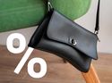 Image of a WhatsApp Business messaging carousel mockup showing a promotional black leather handbags offer with rich media, illustrating marketing campaigns using WhatsApp Business API with interactive, high-conversion messaging.