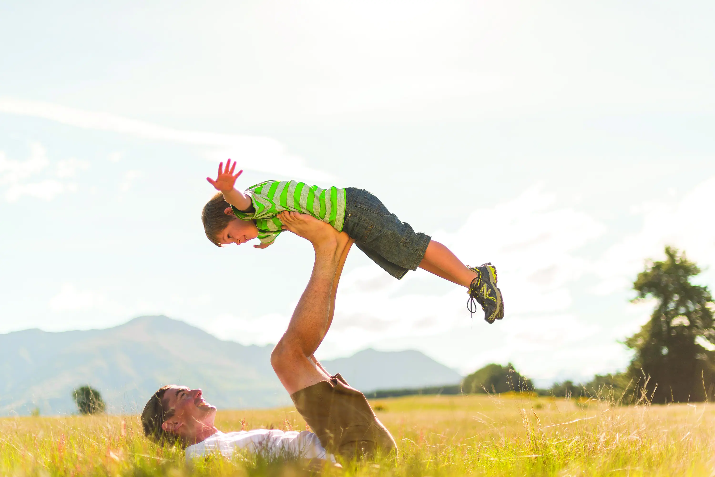 Boy-flying-and-dad