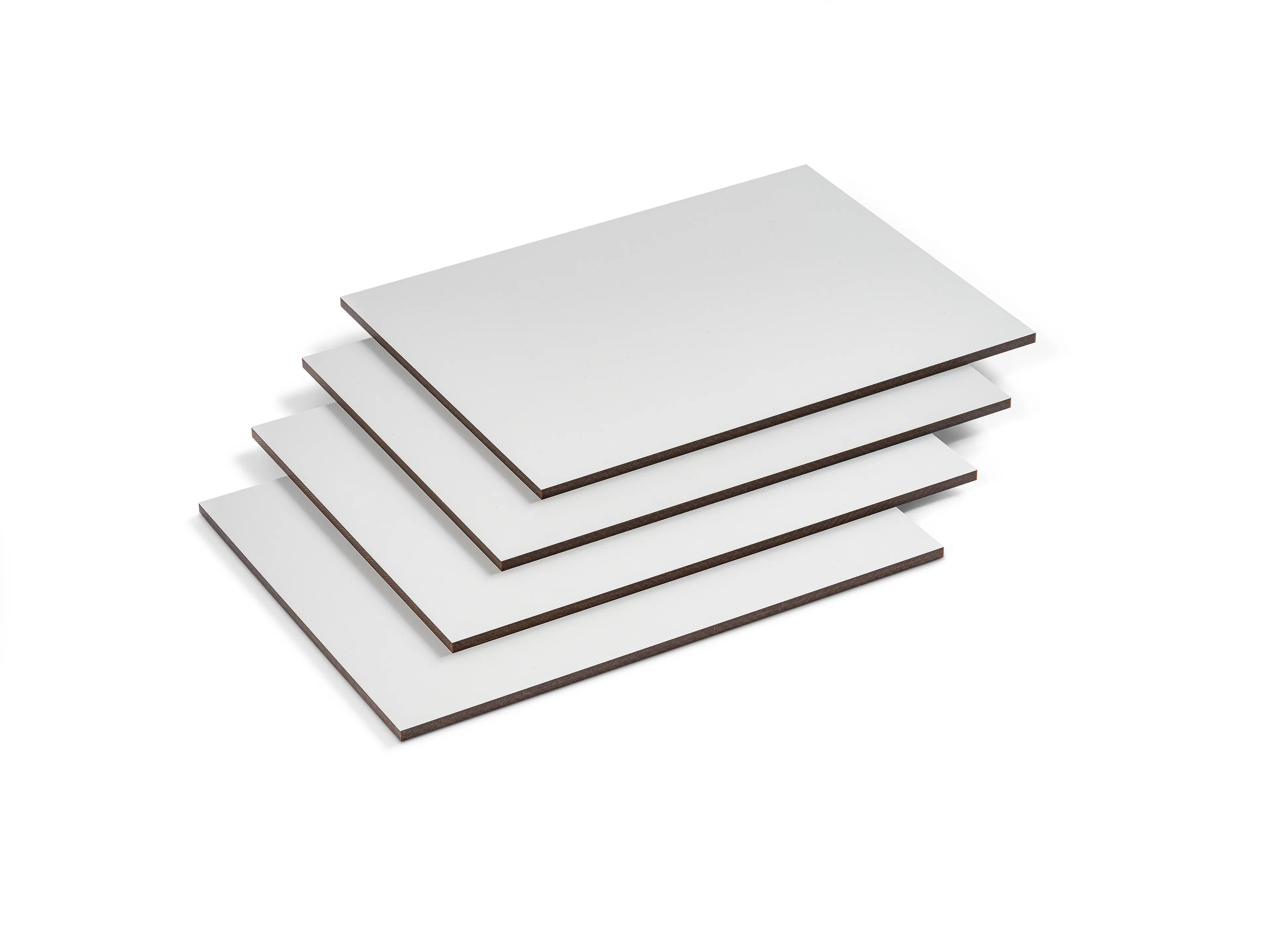 Four stacked white plastic sheets on a white background, slightly offset from each other, showcasing their thinness and smooth texture.