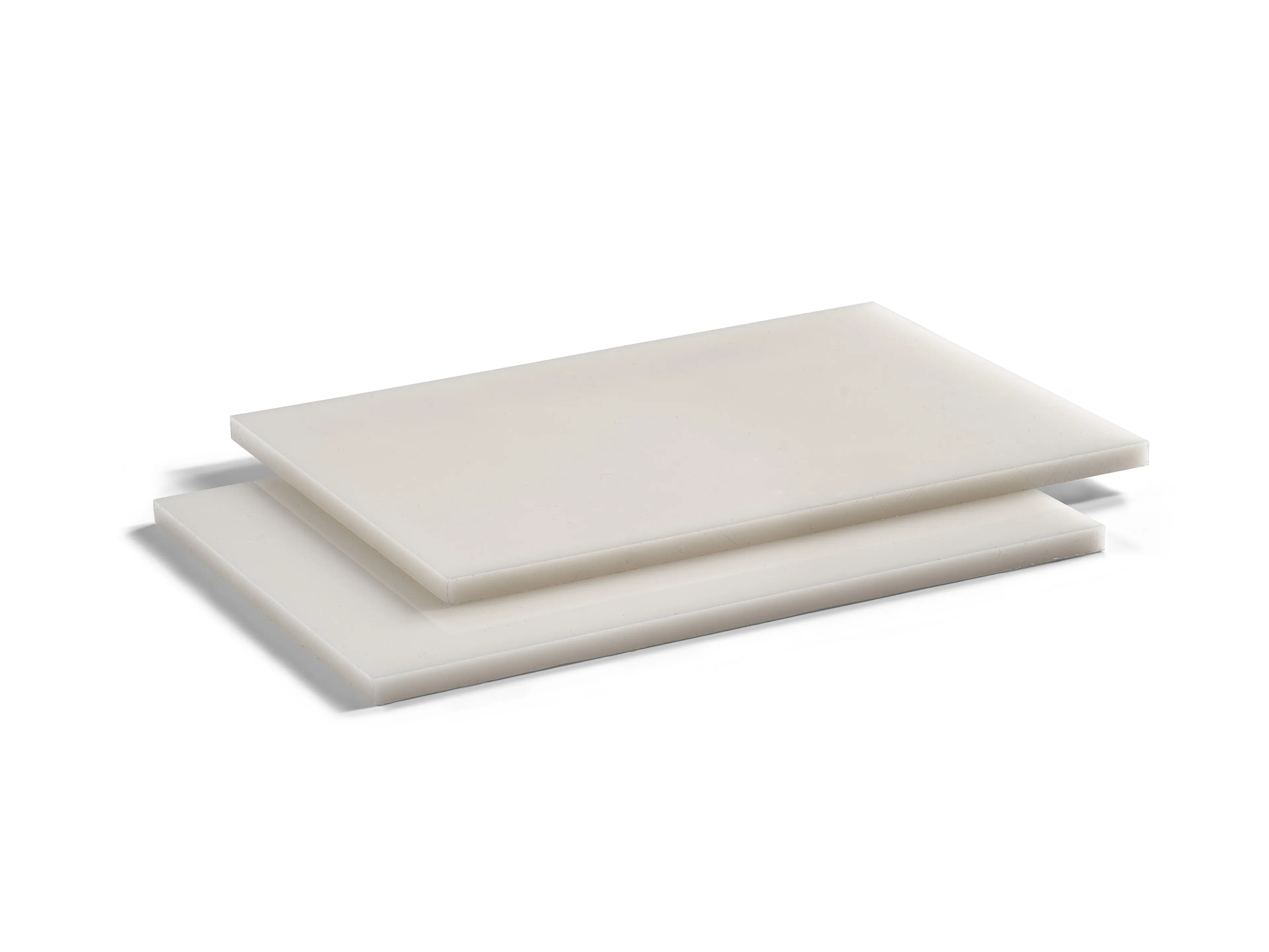 Two stacked rectangular white plastic sheets on a plain white background.