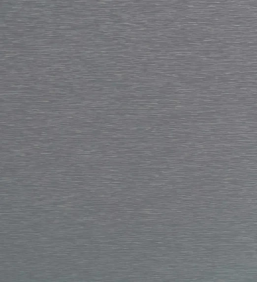 Textured gray metallic surface with a horizontal brushed pattern, reflecting light subtly.