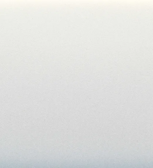 Smooth gradient from cream to light grey, resembling a soft, textured surface or backdrop.