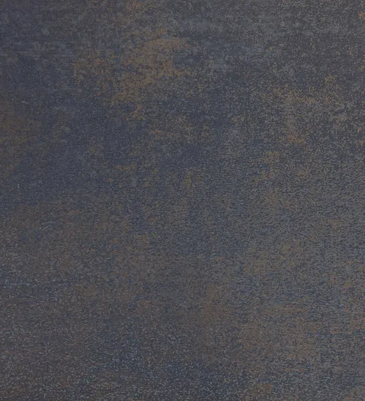 Textured surface with a blend of dark blue and brown tones, creating an abstract, speckled pattern.