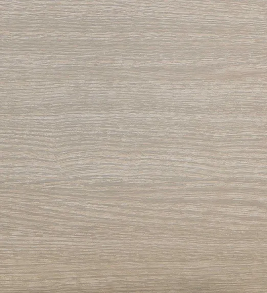 Close-up of a wood grain texture in light beige, showing subtle, wavy patterns and natural lines.