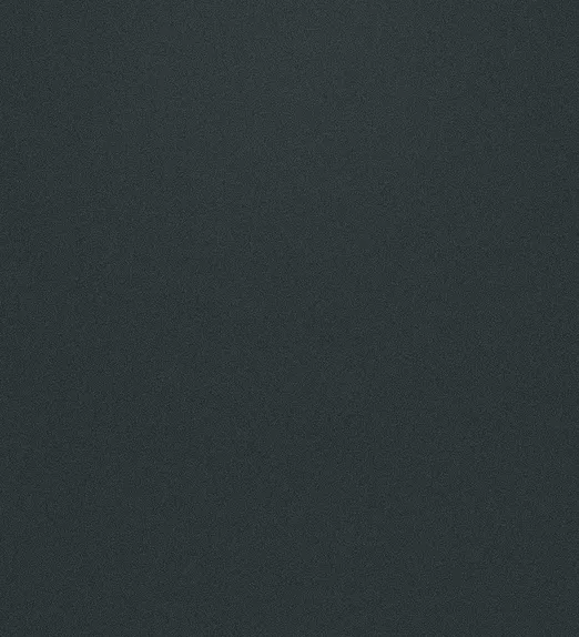 Dark, textured surface with a subtle grainy pattern, resembling a coarse material or fine sandpaper.