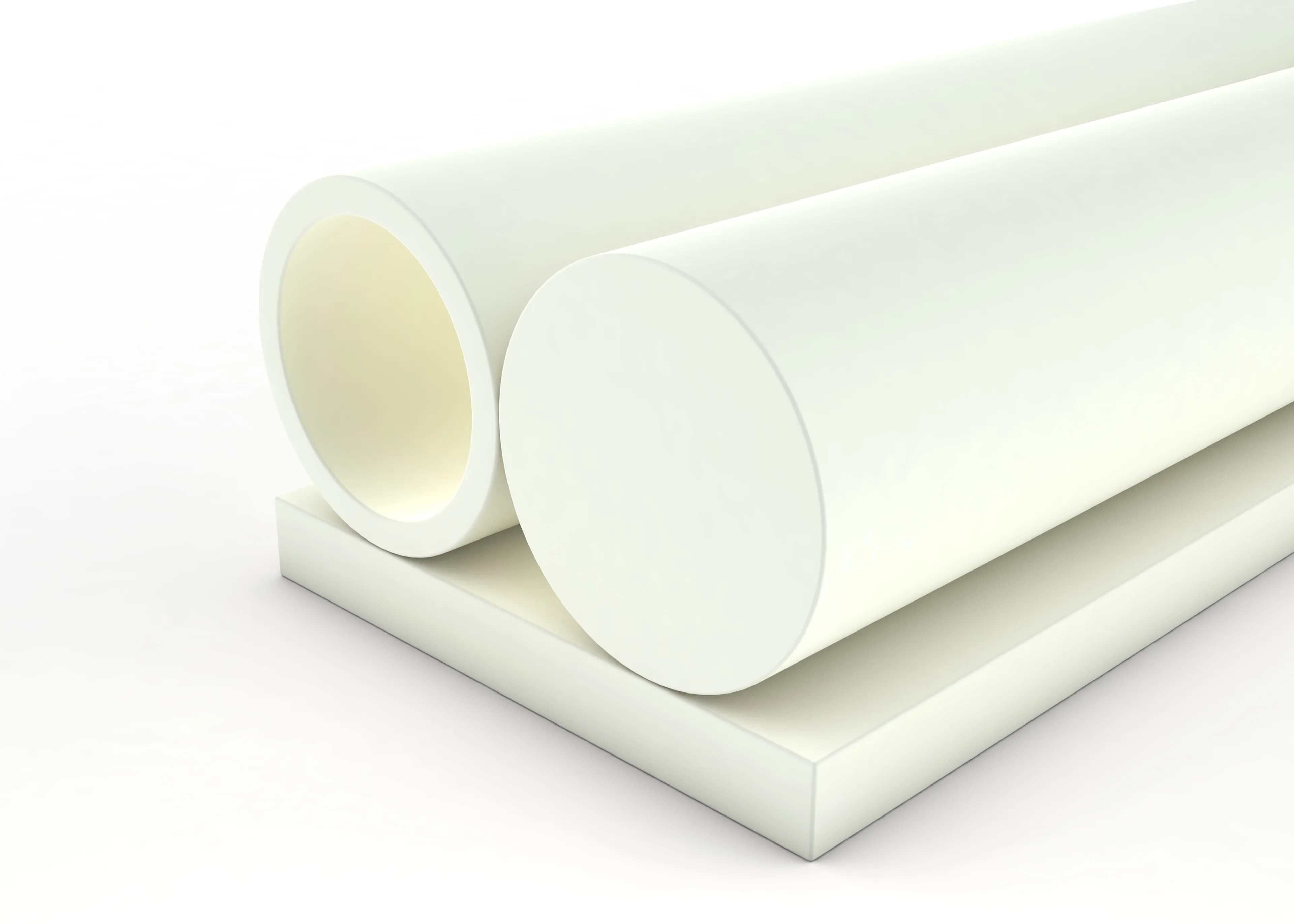Two large, white, cylindrical rods placed on a flat, matching white rectangular slab against a plain white background.