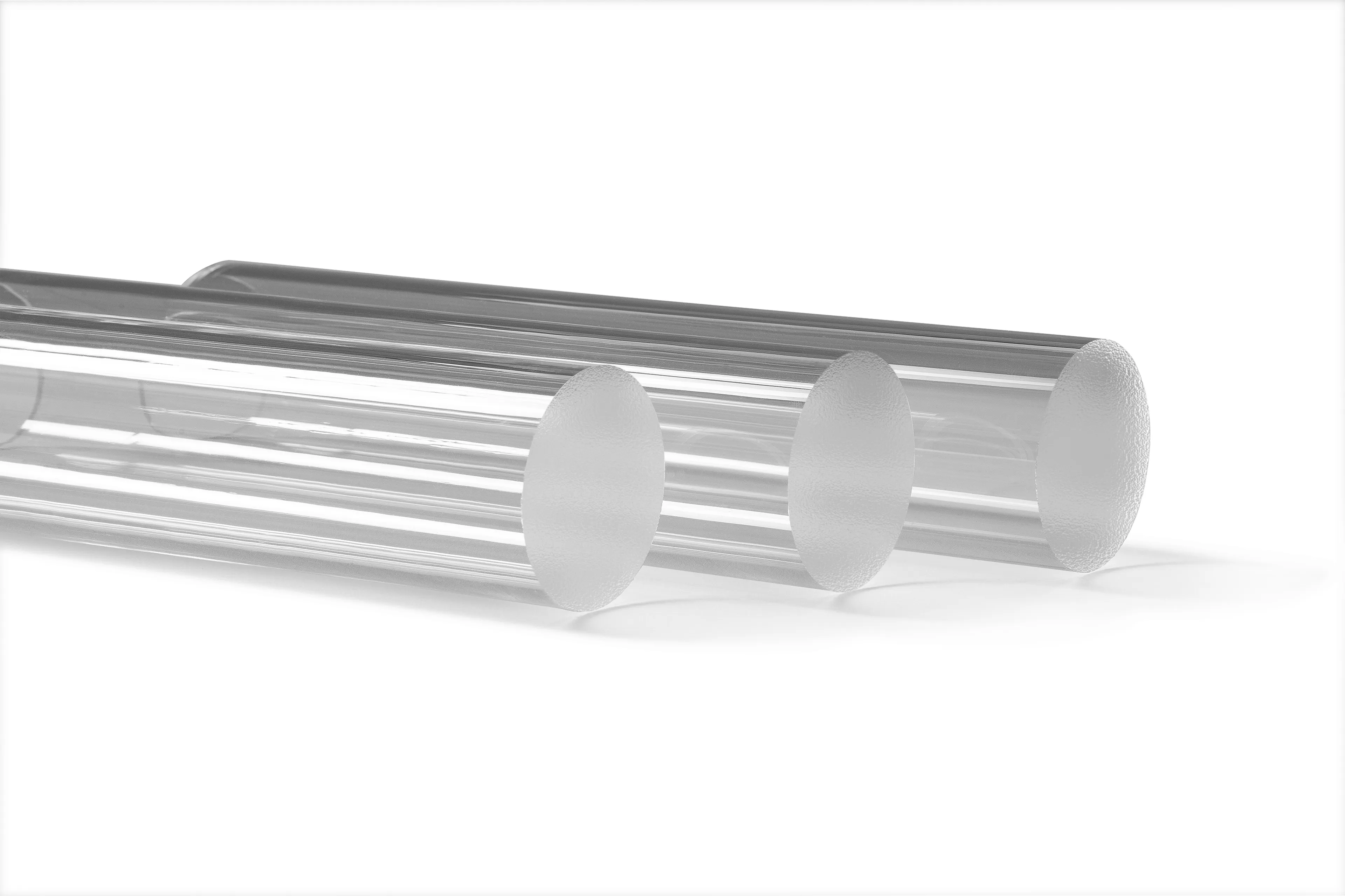 Three transparent glass tubes aligned horizontally on a white background.