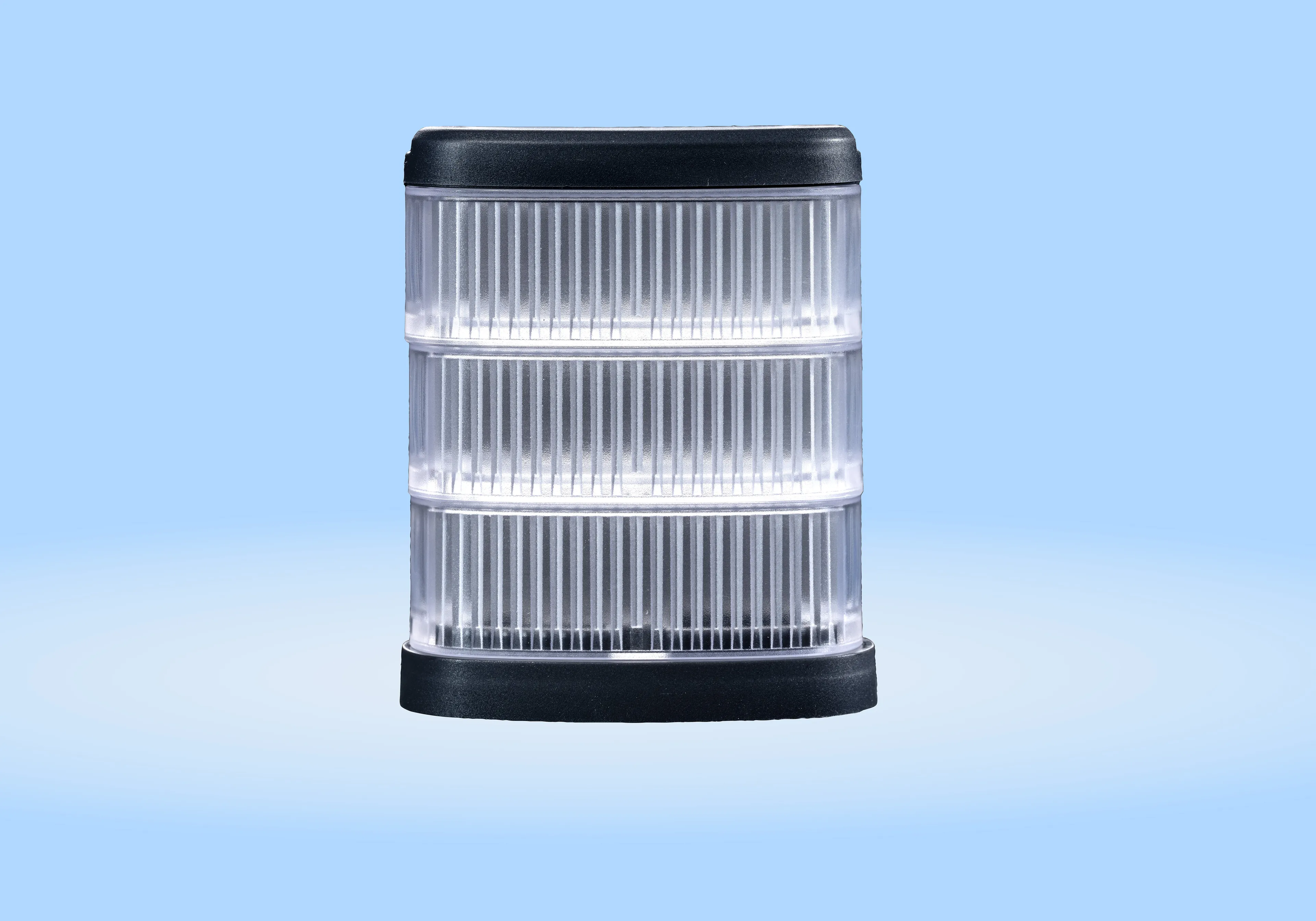 A cylindrical LED light with horizontal ridges and black top and bottom, set against a blue background.