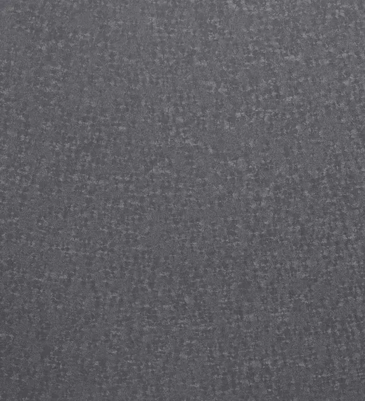 Close-up of a dark blue denim fabric texture, showcasing its woven pattern and subtle variations in shading.