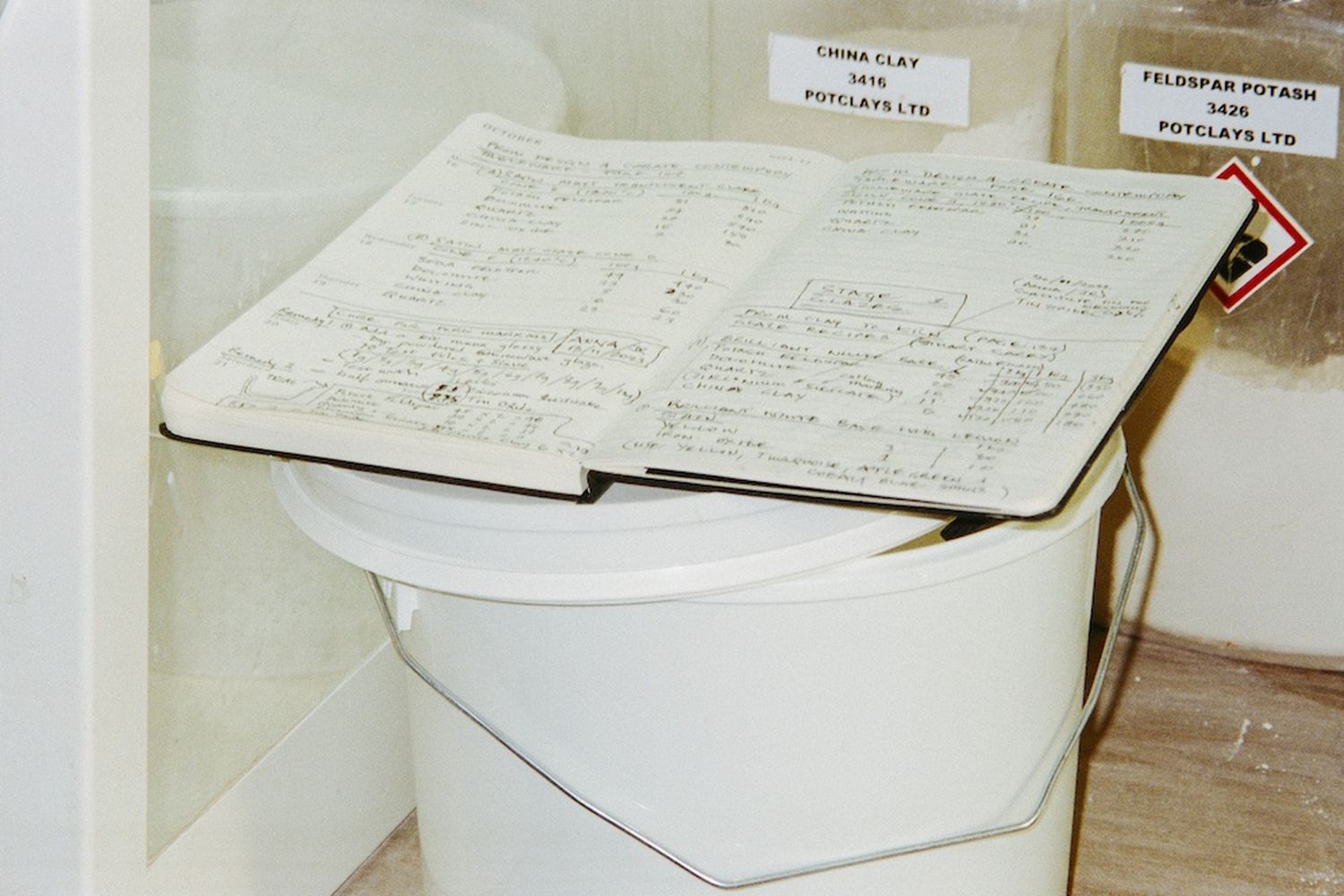 Bucket for clay and notebook for the Central Saint Martins ceramics at The Sessile.
