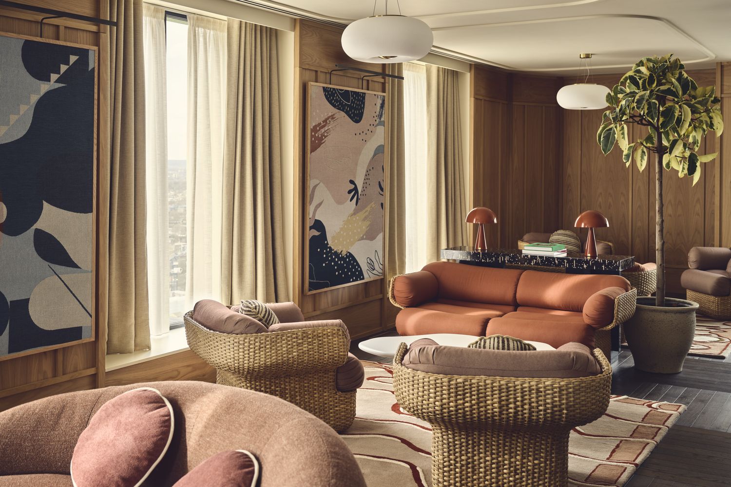A cozy living room with a large window, a brown leather sofa, a brown ottoman, and a white coffee table. A potted plant and a blue and white abstract painting adorn the walls. [G]