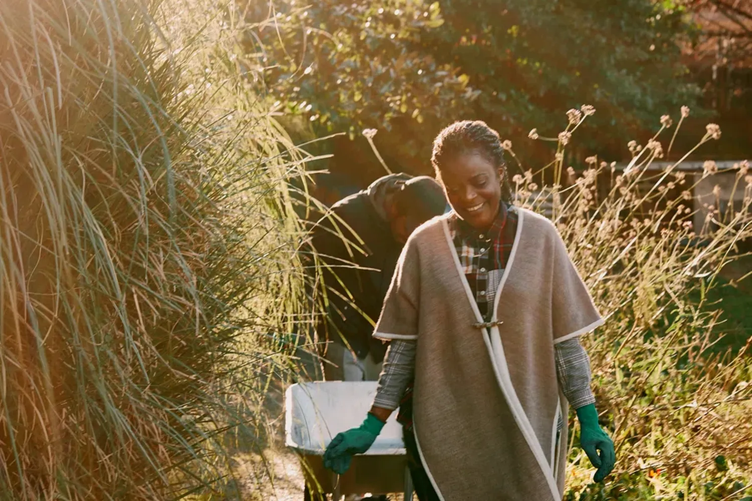 black woman walking through sunset