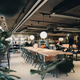 A photo of an office environment with a long table and chairs