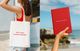 A split photo. One shows a young person wearing a tote bag with the text "Let's create journeys together." The other photo is of a hand holding a red note book with the text "Creating journeys together."