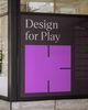 A 'K' logo in purple on a poster that says 'Design for Play'