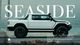 A pickup truck in front of the text Seaside