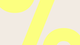 A close up of the % symbol in yellow on a cream background