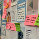 A close up of post-its against poster paper for a workshop