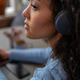 A young woman listening with headset