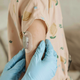 Close-up of a young woman with a skin patch monitor