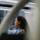 A photo of young woman on a train