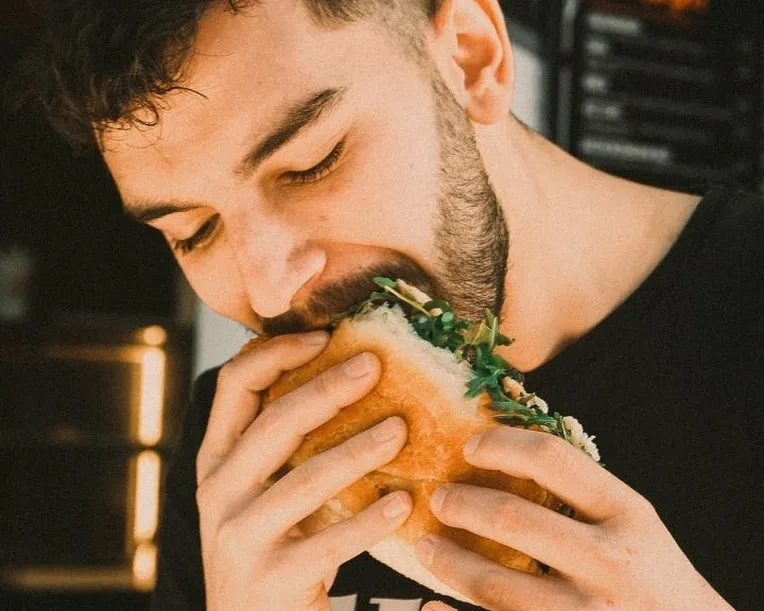 Eating sandwich