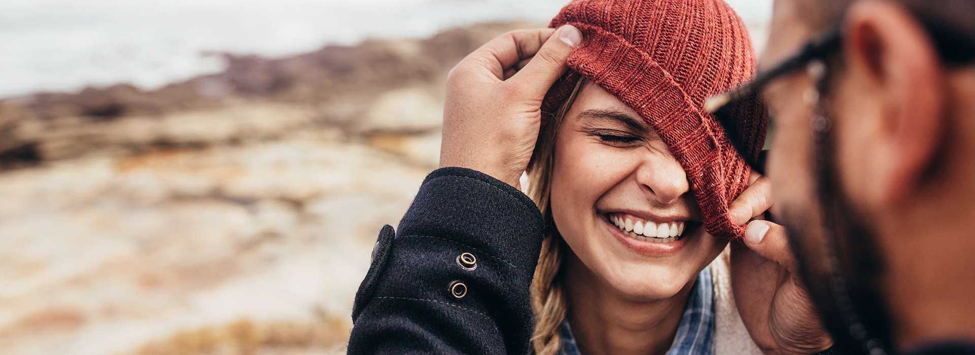 Close up portrait of smiling young couple having fun outdoors