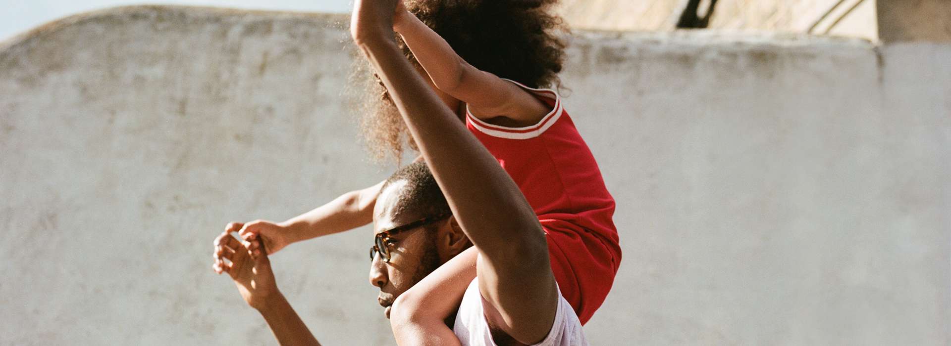 Man/Father having a child on his shoulders
