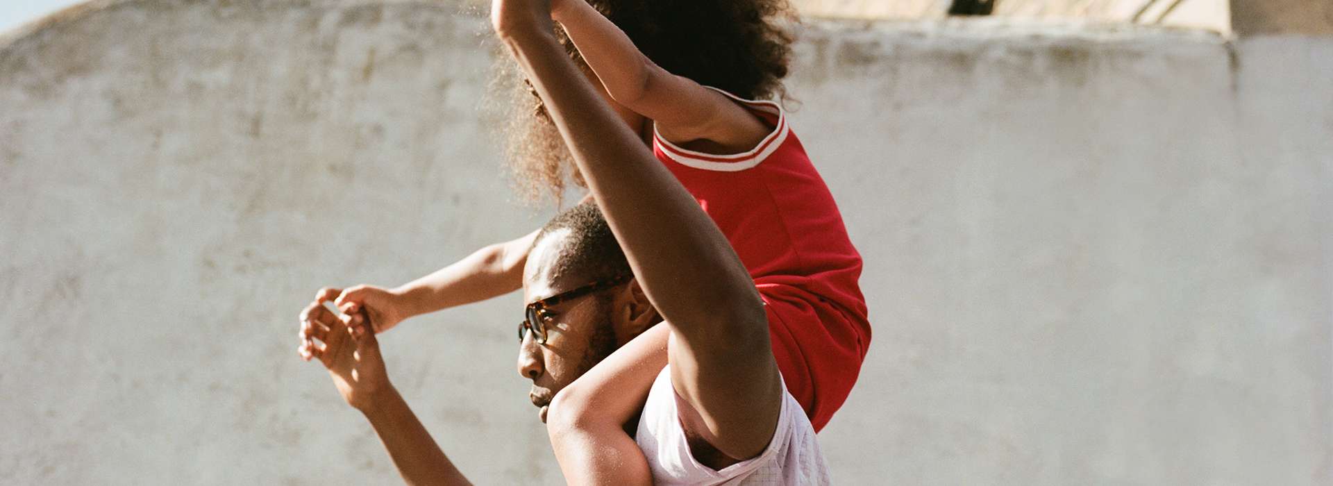 Man/Father having a child on his shoulders