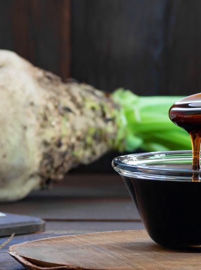 Shows a collection of sugar beets and syrup