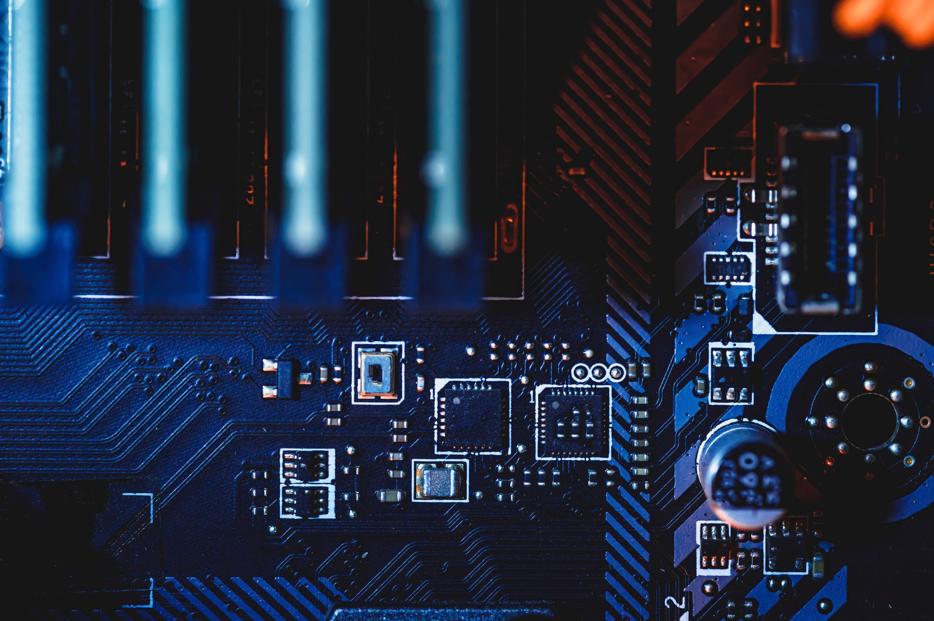 Close-up of a blue circuit board with various electronic components
