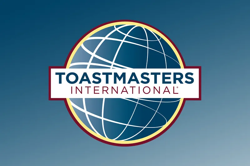 Logo with stylised globe and text "Toastmasters International"