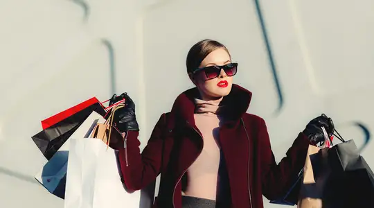 A Woman holding lots of shopping bags