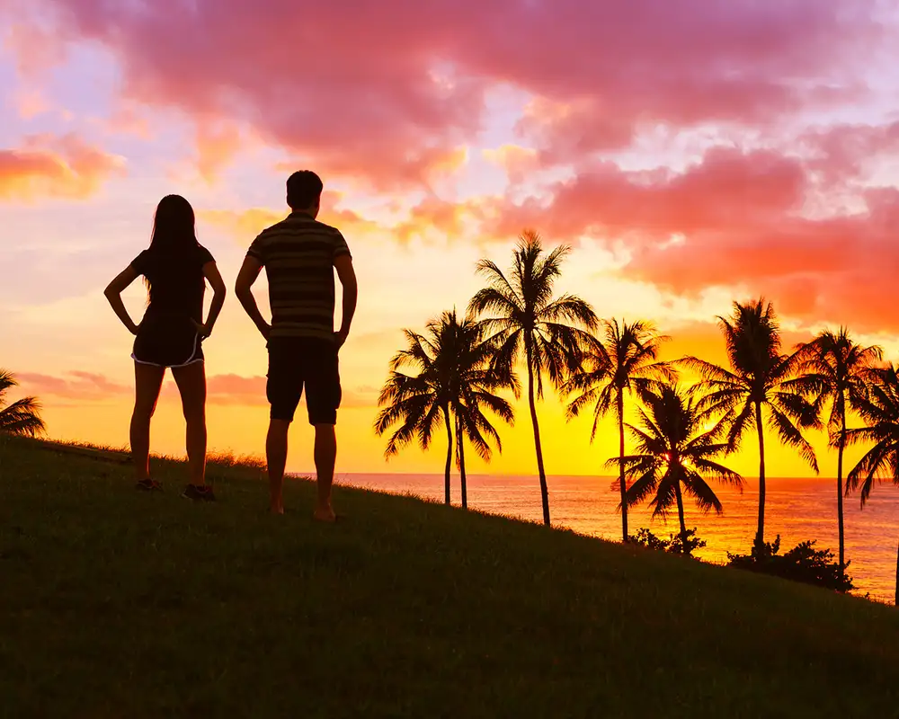 A Couple watching the sunset from a cliff