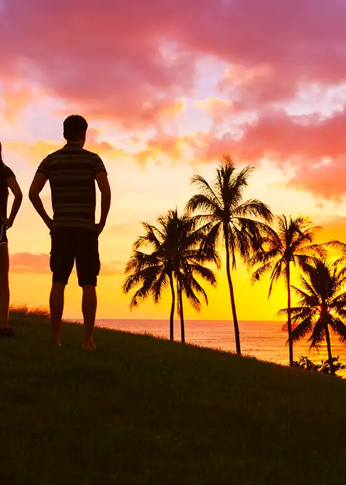 A Couple watching the sunset from a cliff
