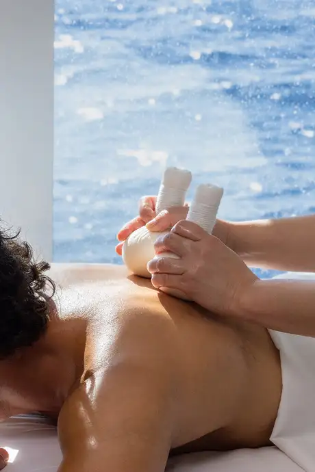 A man getting a spa treatment on a Seabourn Ship