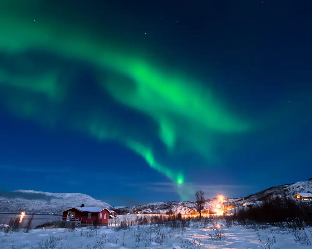 Green lights appear above a Norwegian town