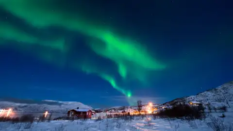 Green lights appear above a Norwegian town
