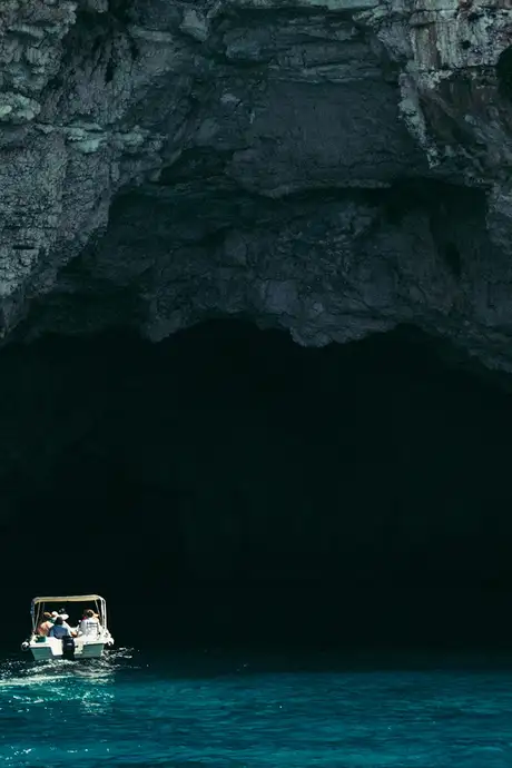 A view of a Boad sailing into the Blue Grotto
