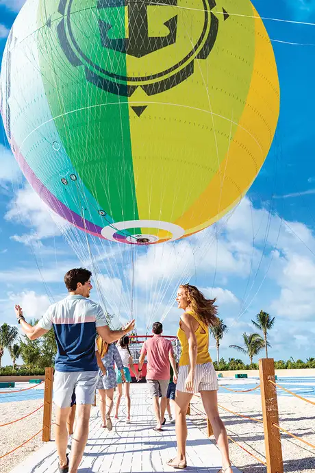 A group of people about to ride on a Hot Air Balloon as a part of Up, Up and Away! on Cococay