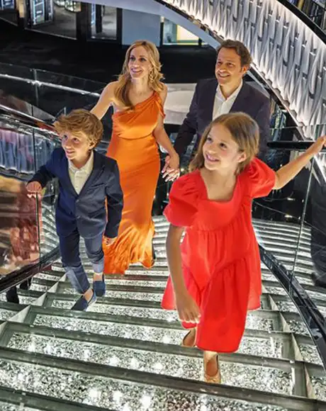 A family walking up stairs on an MSC ship