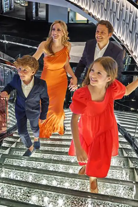 A family walking up stairs on an MSC ship