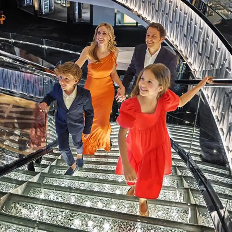 A family walking up stairs on an MSC ship