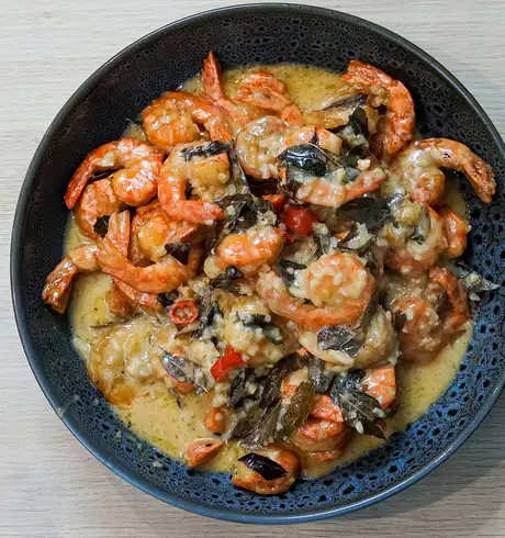 A Seafood dish with rice and a sauce