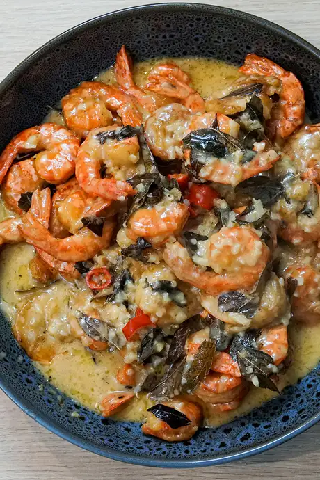 A Seafood dish with rice and a sauce
